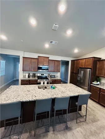 a kitchen with a table and chairs in it