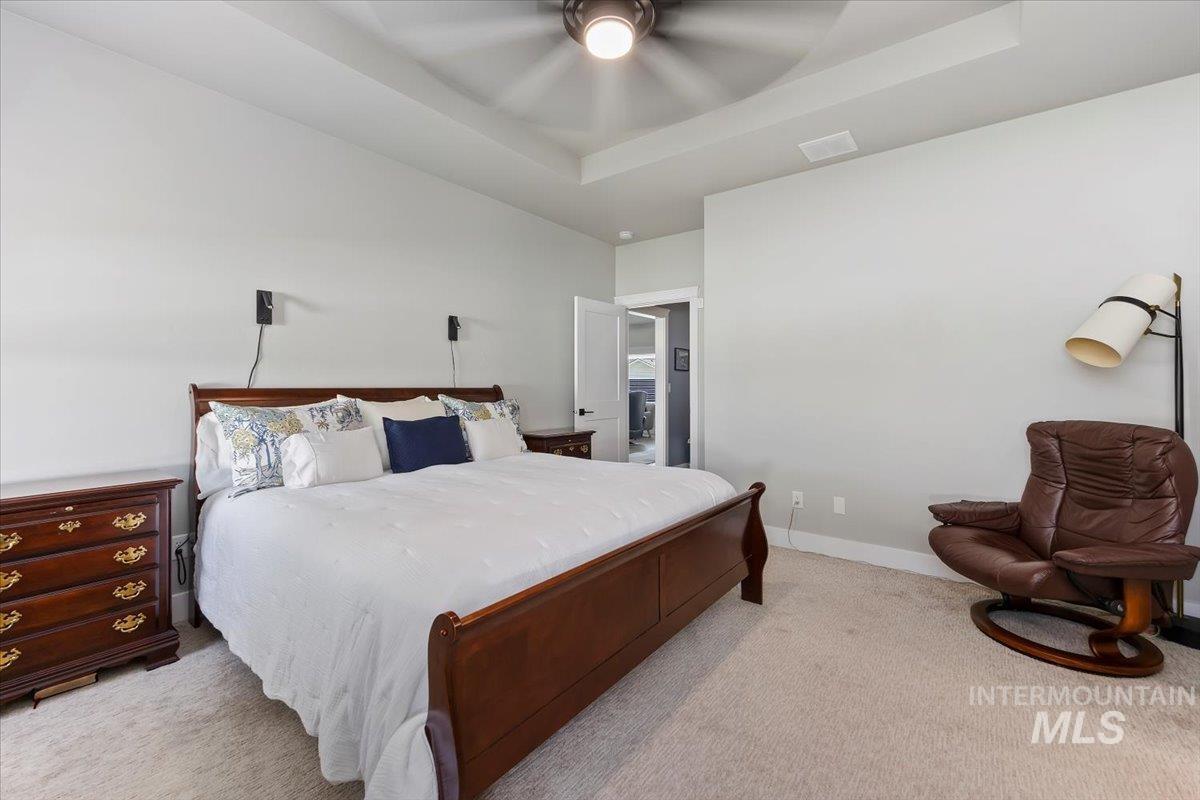 1436 Jump Street Twin Falls, ID 83301 - Photo 16 of 35 Carpeted bedroom with a raised ceiling and a ceiling fan