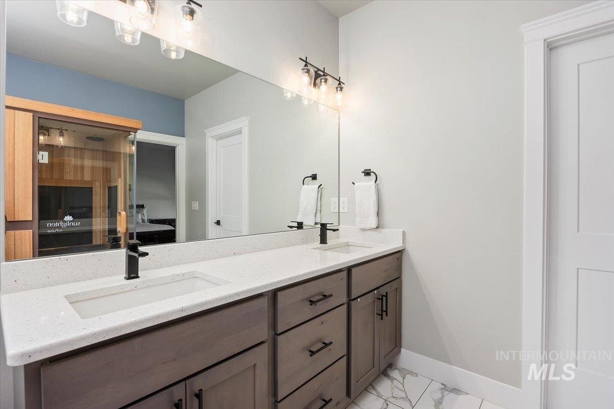 1436 Jump Street Twin Falls, ID 83301 - Photo 20 of 35 Full bathroom with a sauna, ensuite bathroom, double vanity, and light marble finish floors