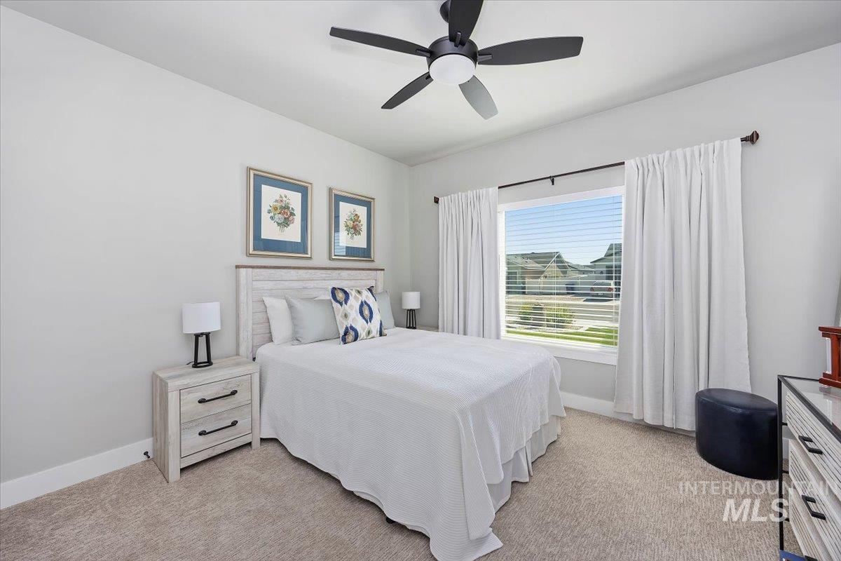 1436 Jump Street Twin Falls, ID 83301 - Photo 21 of 35 Bedroom with a ceiling fan and light carpet