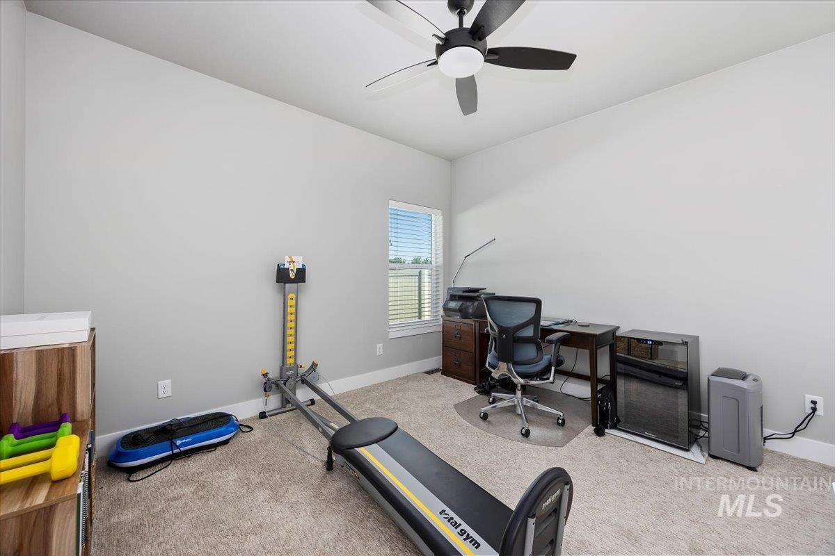1436 Jump Street Twin Falls, ID 83301 - Photo 23 of 35 Home office featuring light colored carpet and ceiling fan
