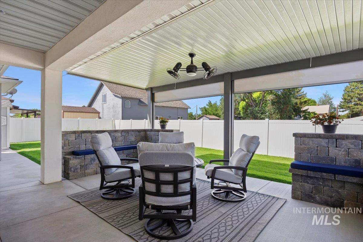 1436 Jump Street Twin Falls, ID 83301 - Photo 27 of 35 Fenced backyard featuring a patio, a ceiling fan, and an outdoor hangout area