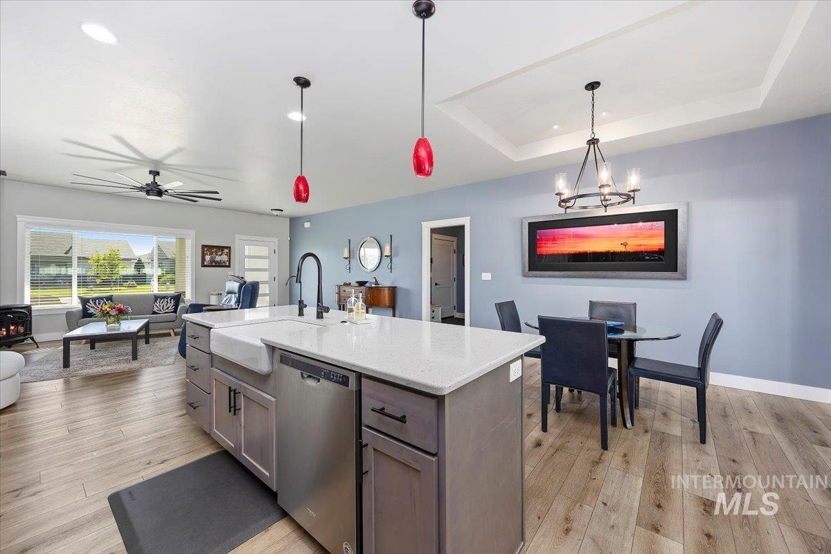 1436 Jump Street Twin Falls, ID 83301 - Photo 8 of 35 Kitchen featuring dishwasher, pendant lighting, light stone countertops, light wood finished floors, and recessed lighting