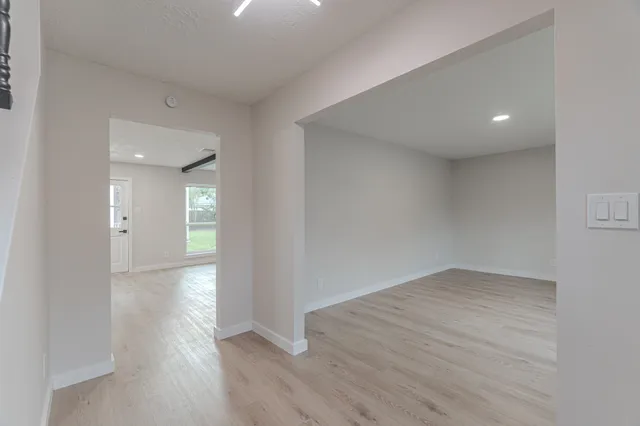 a view of a kitchen with a sink and a refrigerator