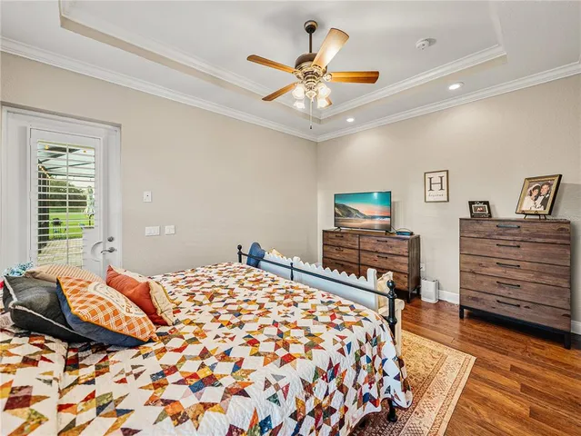 a view of a swimming pool with chairs in patio