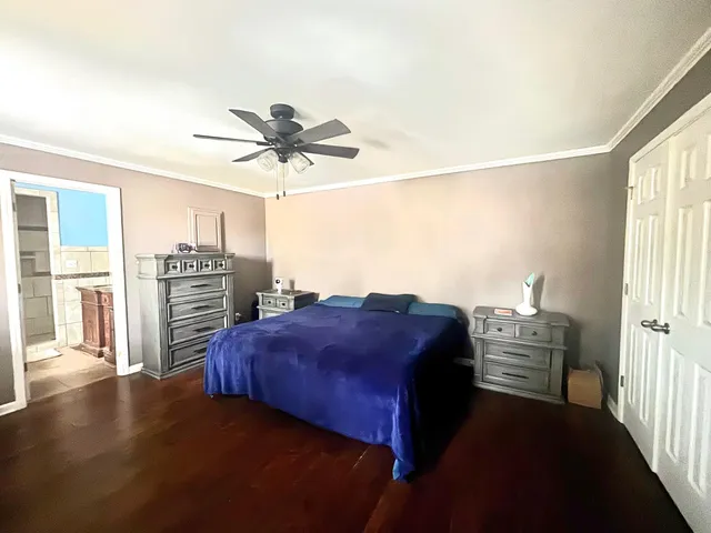 a bathroom with a granite countertop sink a mirror and a bathtub