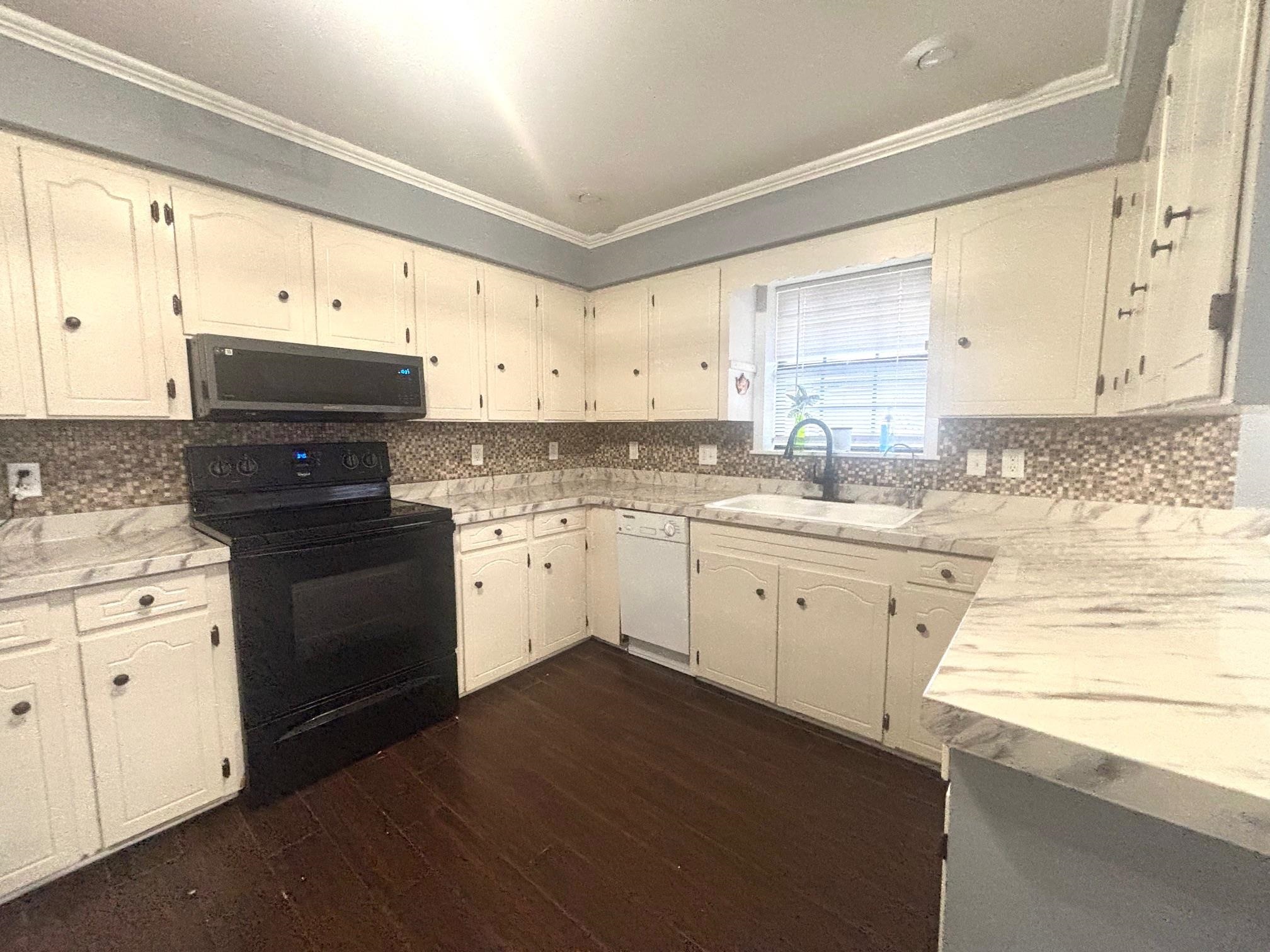2 Cr 198 Road Iuka, MS 38852 - Photo 16 of 24 a kitchen with granite countertop white cabinets white appliances and sink