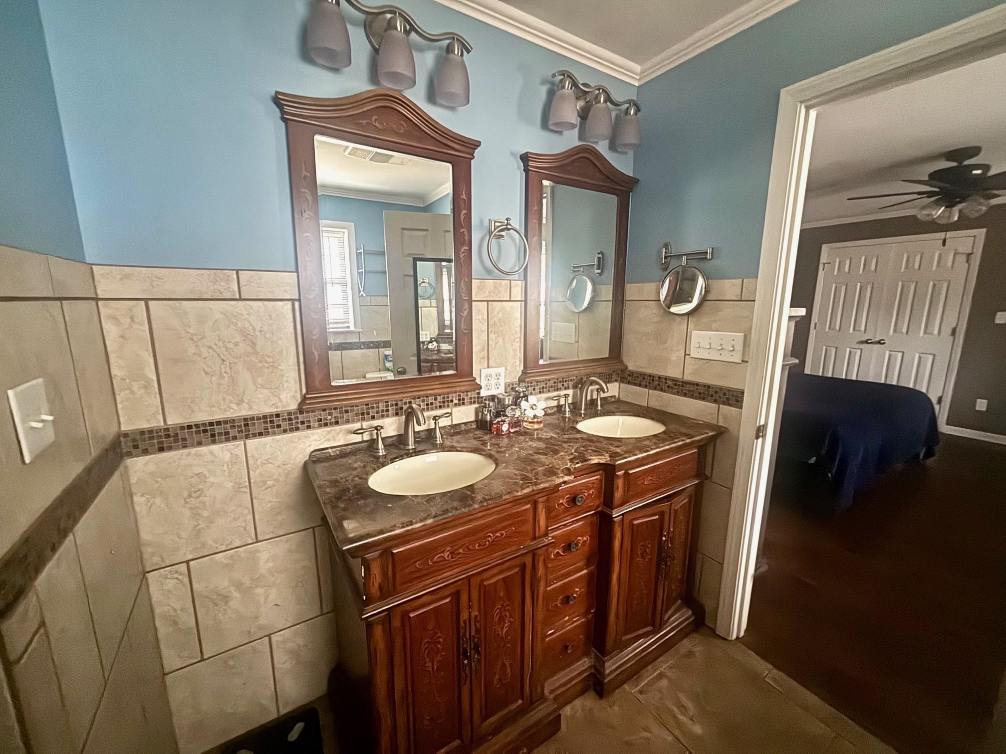 2 Cr 198 Road Iuka, MS 38852 - Photo 18 of 24 Bathroom with crown molding and double vanity.
