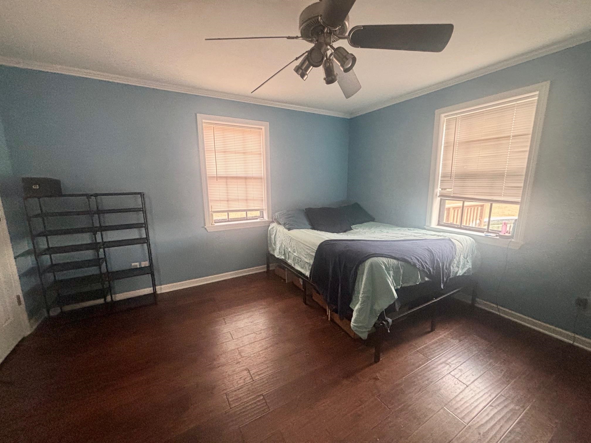 2 Cr 198 Road Iuka, MS 38852 - Photo 20 of 24 Bedroom with crown molding, dark wood-type flooring, and a ceiling fan