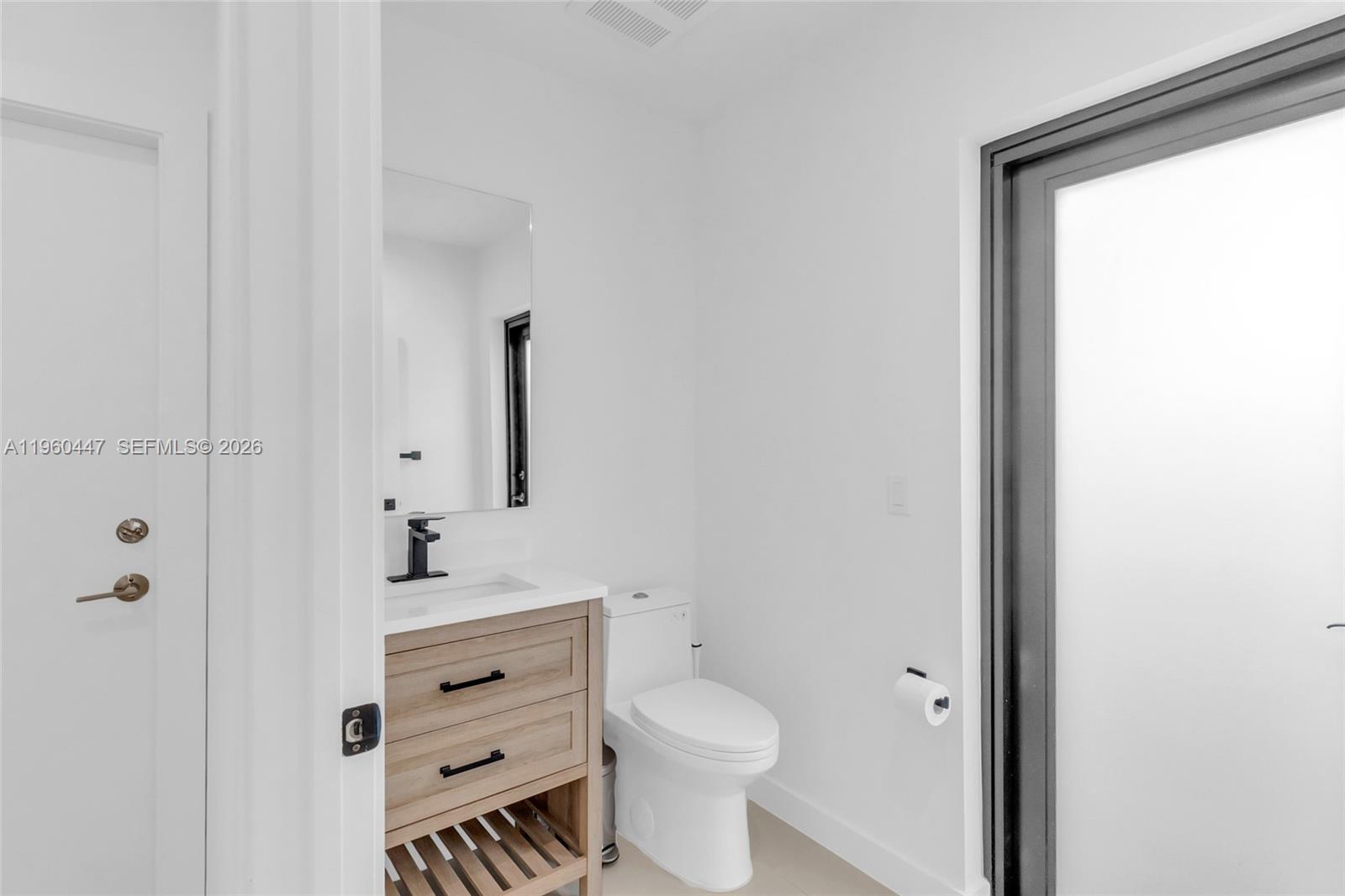 2029 Southwest 62nd Avenue Miami, FL 33155 - Photo 12 of 43 a bathroom with a sink toilet and shower