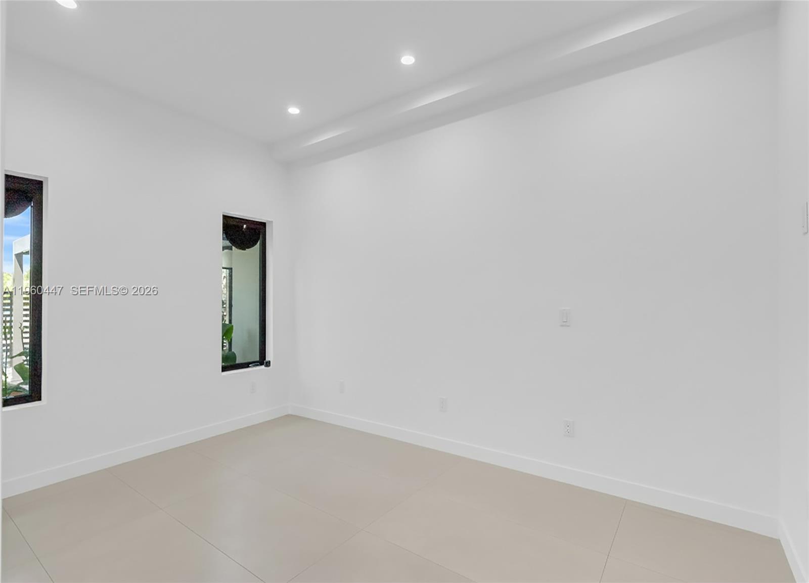 2029 Southwest 62nd Avenue Miami, FL 33155 - Photo 14 of 43 a view of an empty room with a window