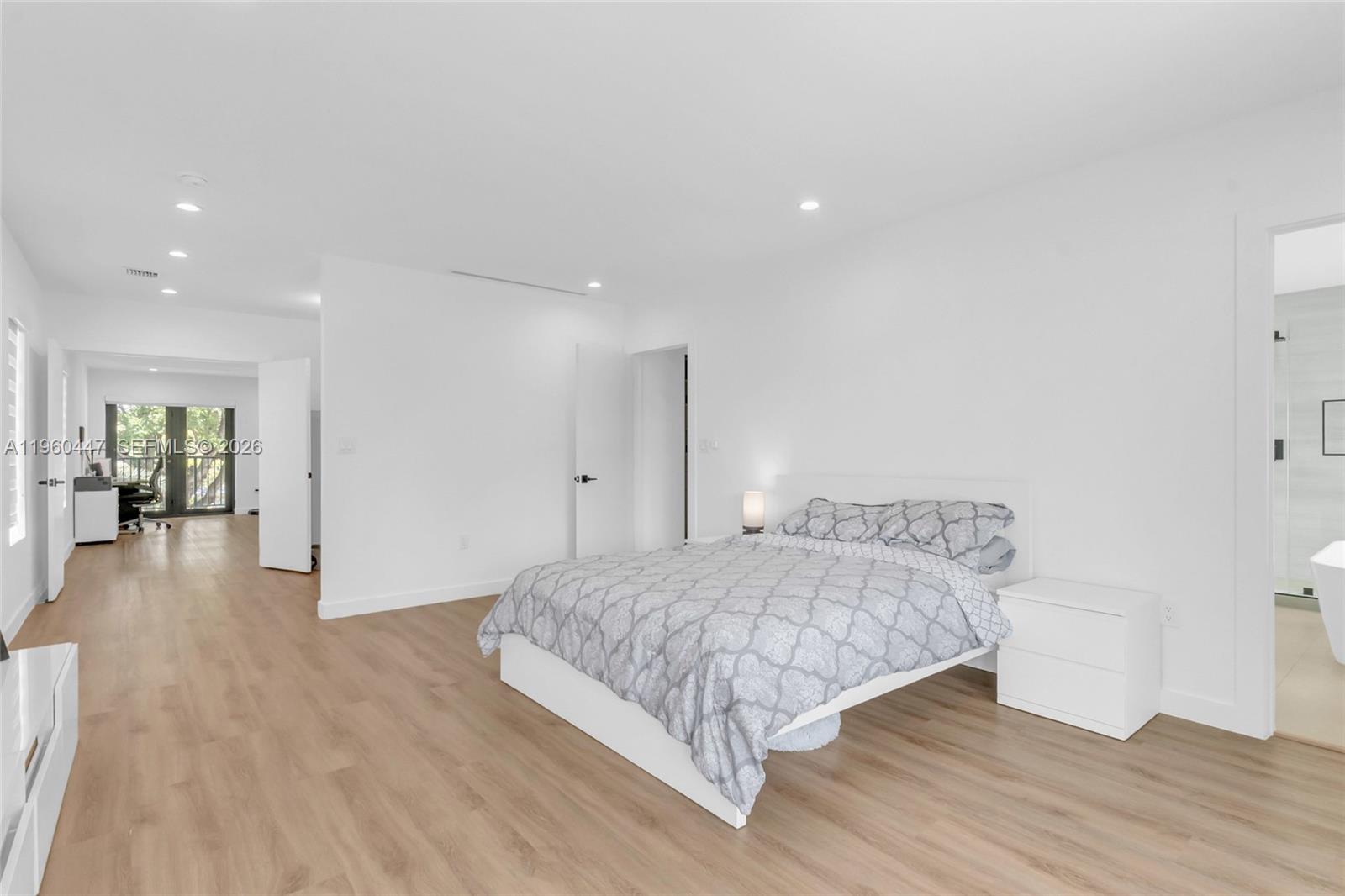 2029 Southwest 62nd Avenue Miami, FL 33155 - Photo 19 of 43 a bedroom with a bed and a wooden floor