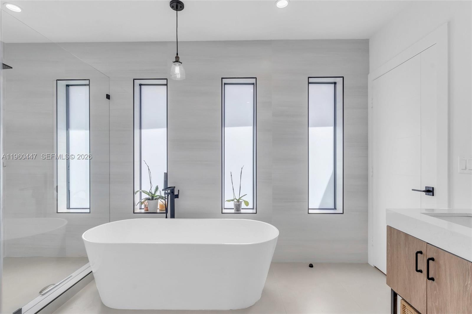 2029 Southwest 62nd Avenue Miami, FL 33155 - Photo 21 of 43 a spacious bathroom with a tub sink and mirror