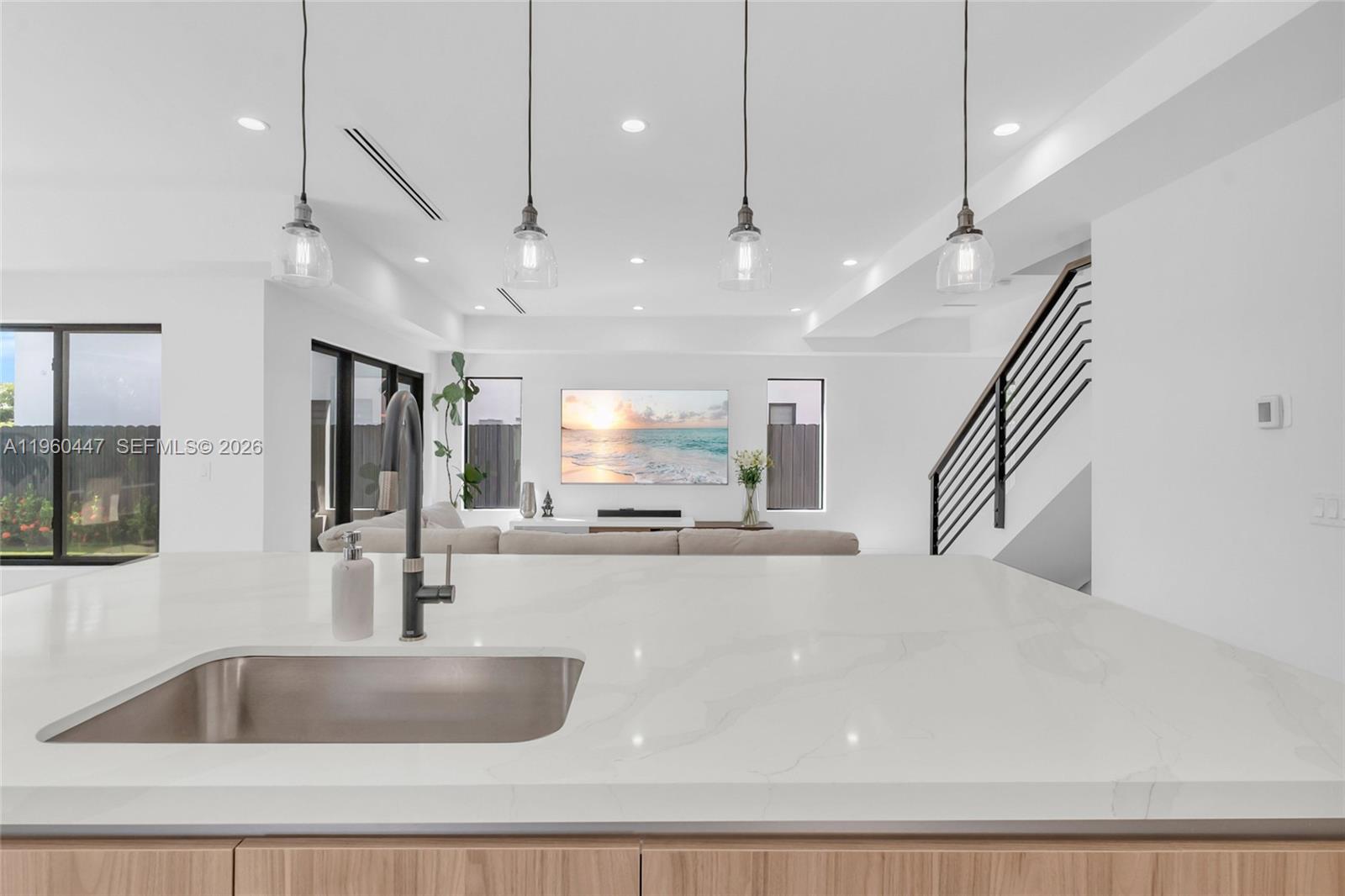 2029 Southwest 62nd Avenue Miami, FL 33155 - Photo 10 of 43 a kitchen with kitchen island a large counter space appliances and windows