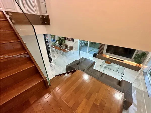 a workspace with furniture and stairs