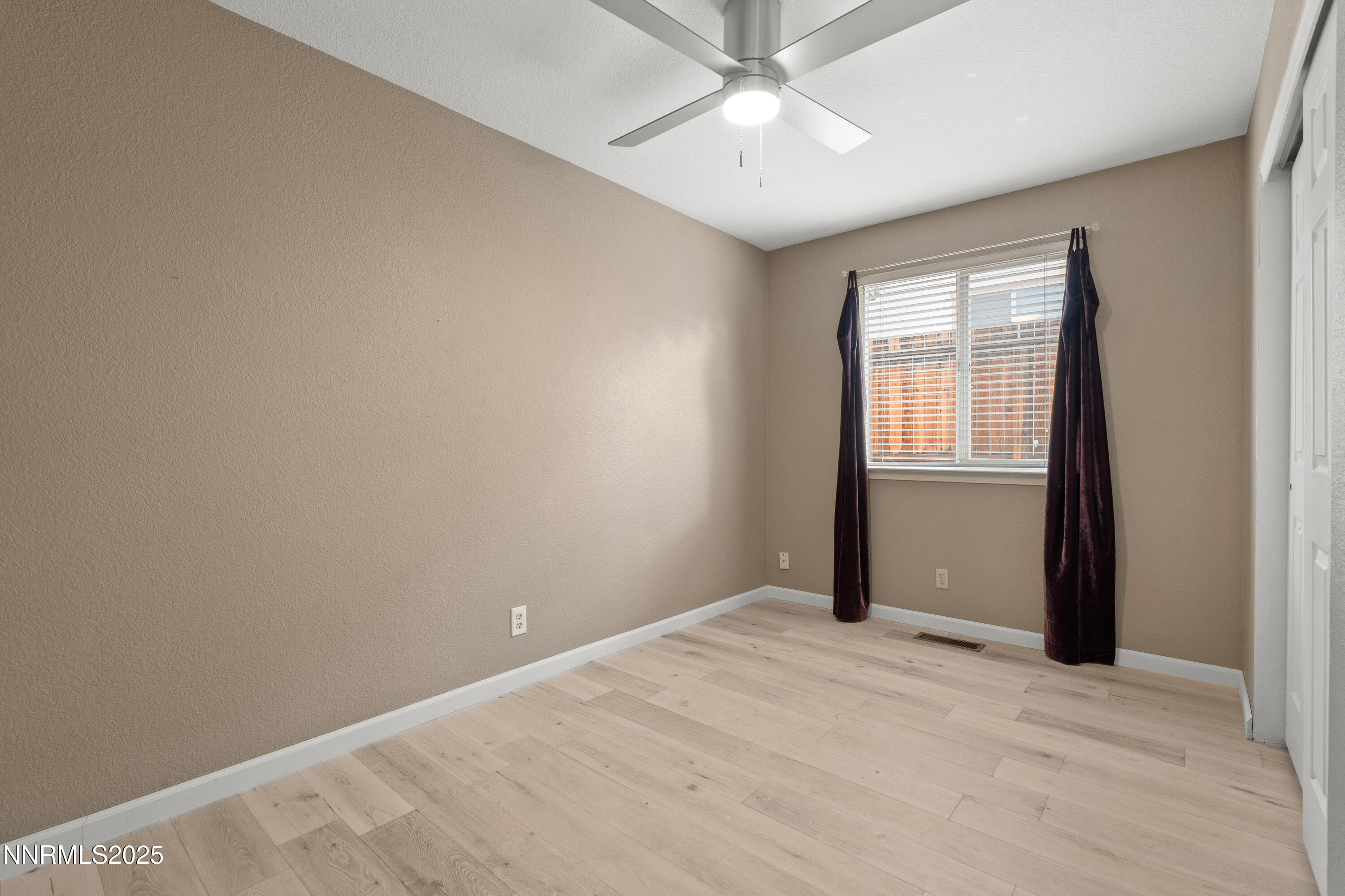 997 Ridgeview Drive Carson City, NV 89705 - Photo 21 of 32 a view of an empty room with a window