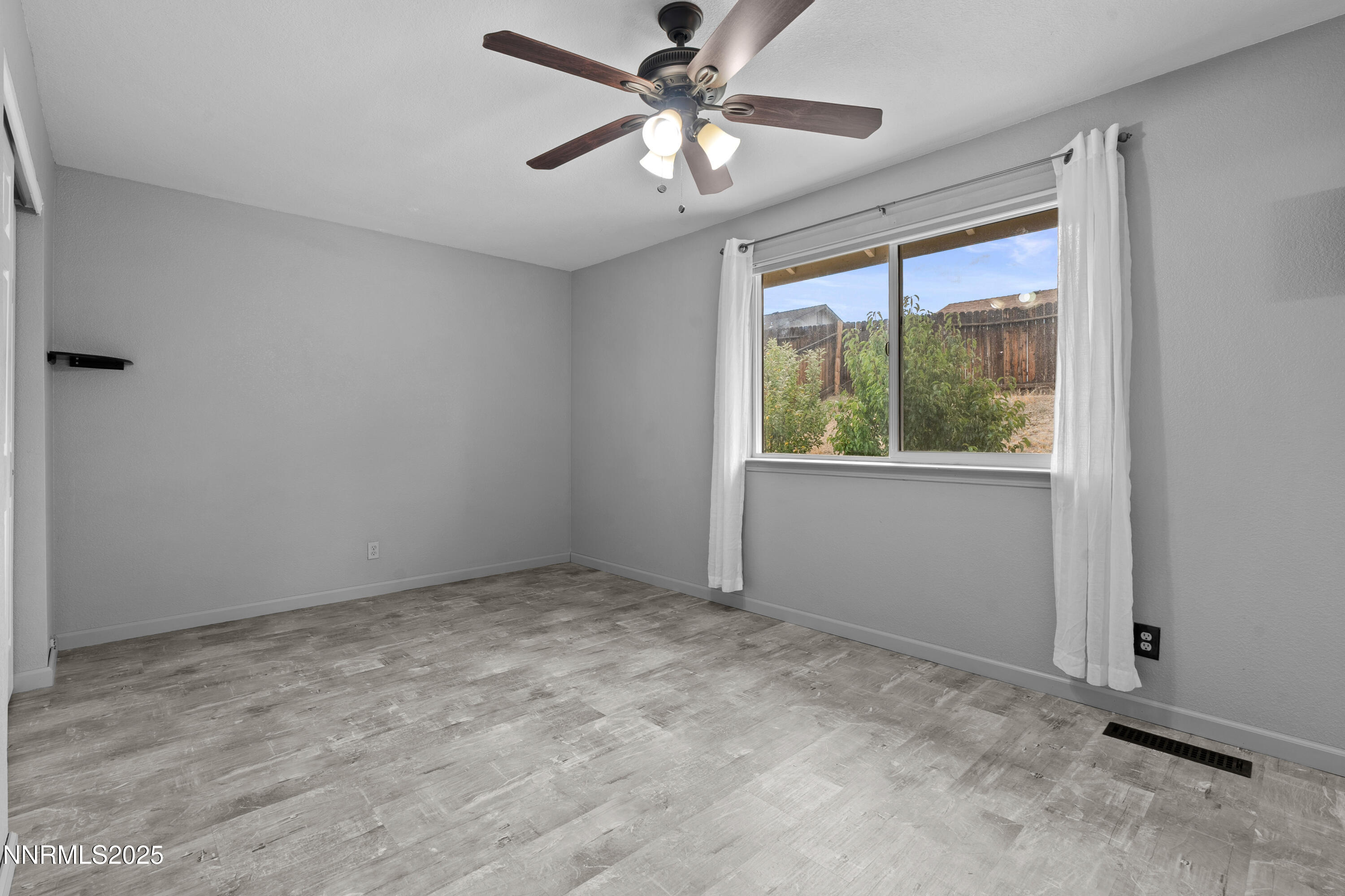 997 Ridgeview Drive Carson City, NV 89705 - Photo 23 of 32 a view of an empty room with a window