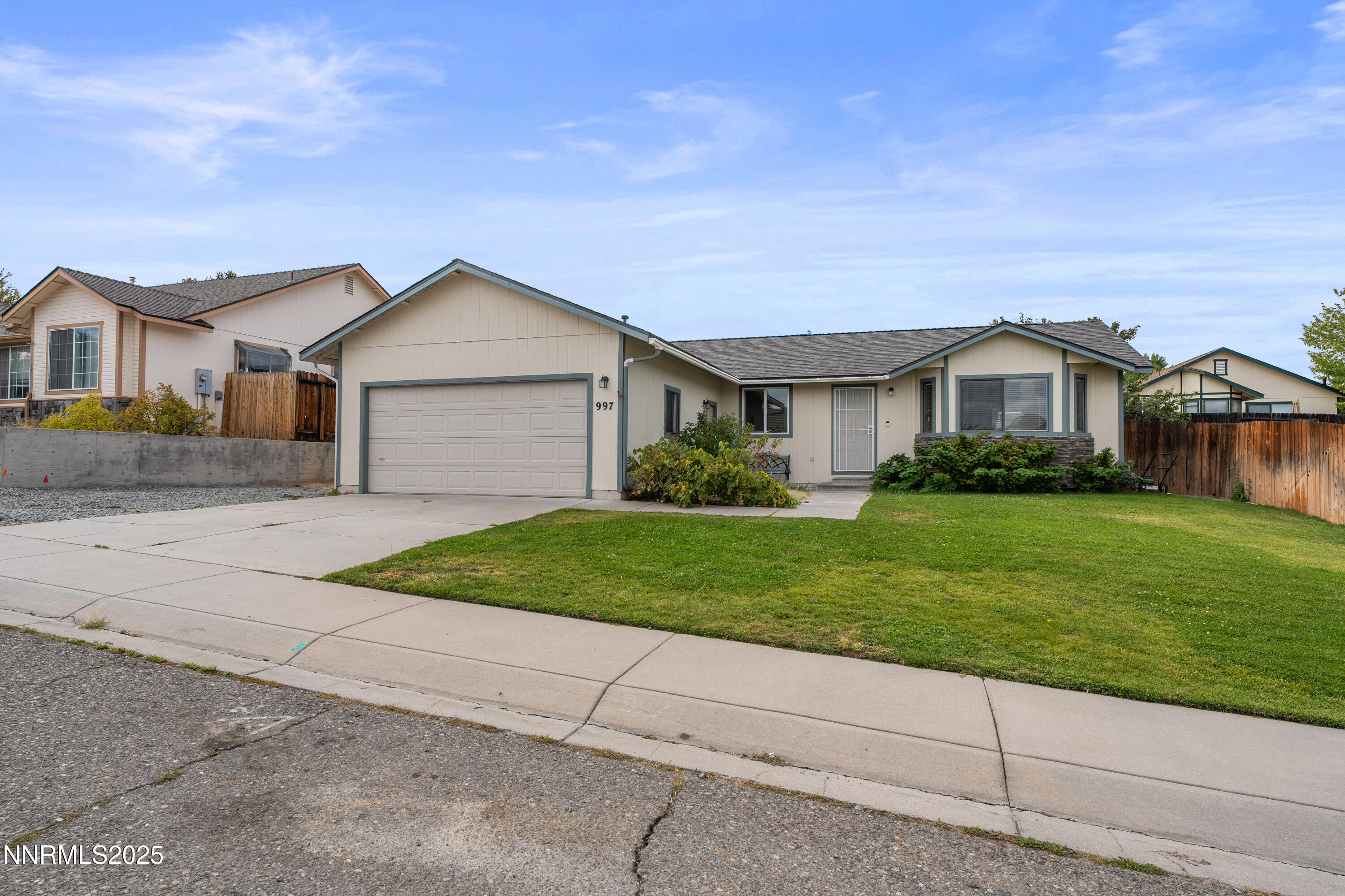 997 Ridgeview Drive Carson City, NV 89705 - Photo 3 of 32 a front view of house with yard and green space