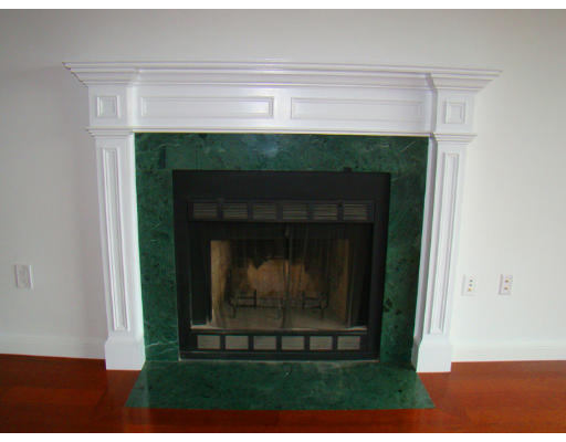 390 Commonwealth Avenue, Unit 710 Boston, MA 02215 - Photo 6 of 14 a living room with a fireplace