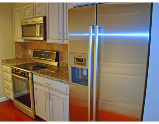 390 Commonwealth Avenue, Unit 710 Boston, MA 02215 - Photo 8 of 14 a kitchen with stainless steel appliances granite countertop a refrigerator and a stove