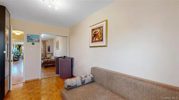 a living room with furniture and a dining table