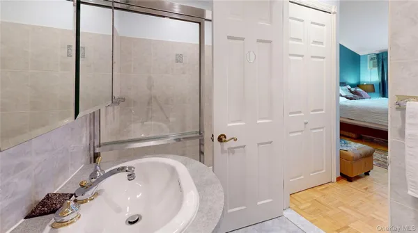a bathroom with a sink and shower
