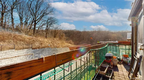 a view of a balcony with two chairs