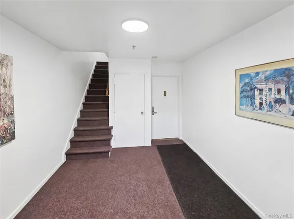 a view of an entryway with stairs