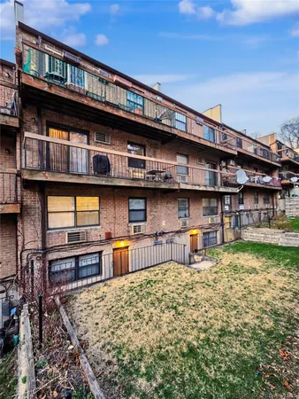 a large building with a large window and chairs