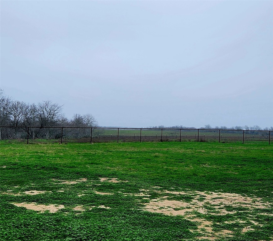 446 County Road 446 Waelder, TX 78959 - Photo 13 of 25 a view of a green field with clear sky
