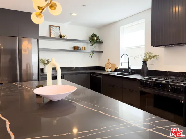a kitchen with a sink and a stove