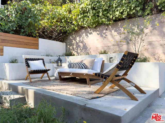 a view of barbeque area with seating area