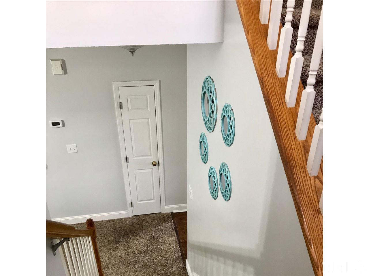 8612 Neuse Hunter Drive Raleigh, NC 27616 - Photo 11 of 23 a view of an entryway with wooden floor