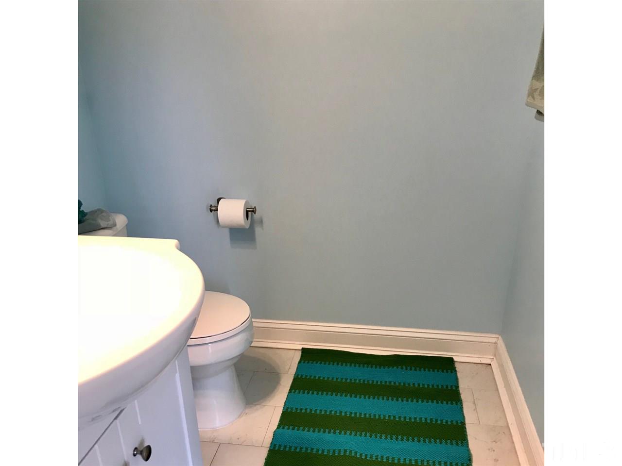 8612 Neuse Hunter Drive Raleigh, NC 27616 - Photo 14 of 23 a bathroom with a sink and a toilet