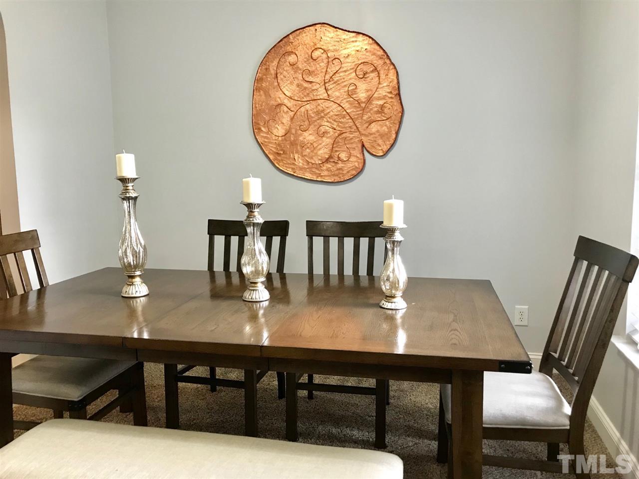 8612 Neuse Hunter Drive Raleigh, NC 27616 - Photo 6 of 23 a view of a dining room with furniture