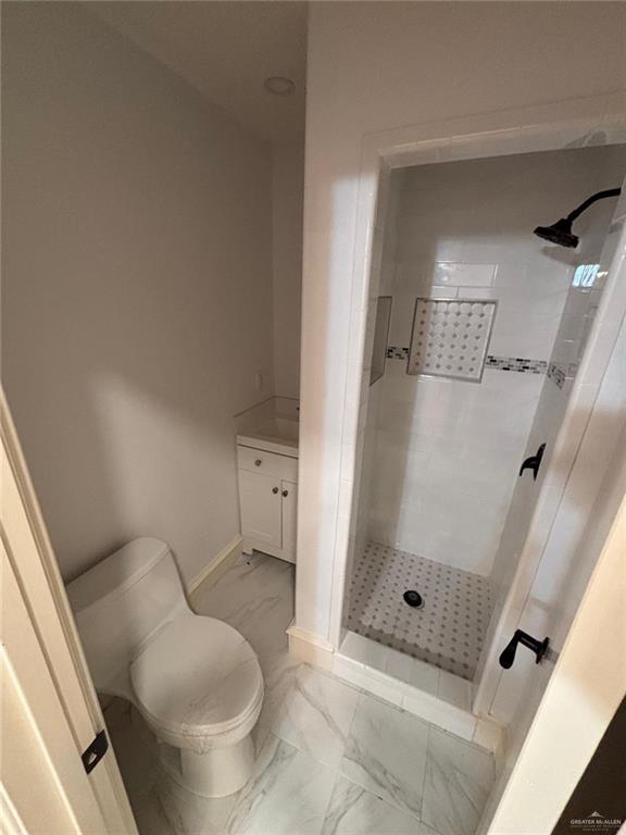 101 Harvey Street McAllen, TX 78501 - Photo 11 of 14 a bathroom with a toilet and a shower