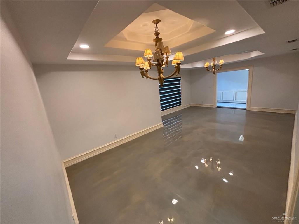 101 Harvey Street McAllen, TX 78501 - Photo 4 of 14 a view of a livingroom with a chandelier