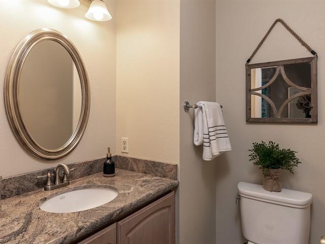 78 Redding Road Campbell, CA 95008 - Photo 8 of 22 a bathroom with a granite countertop toilet a sink and mirror