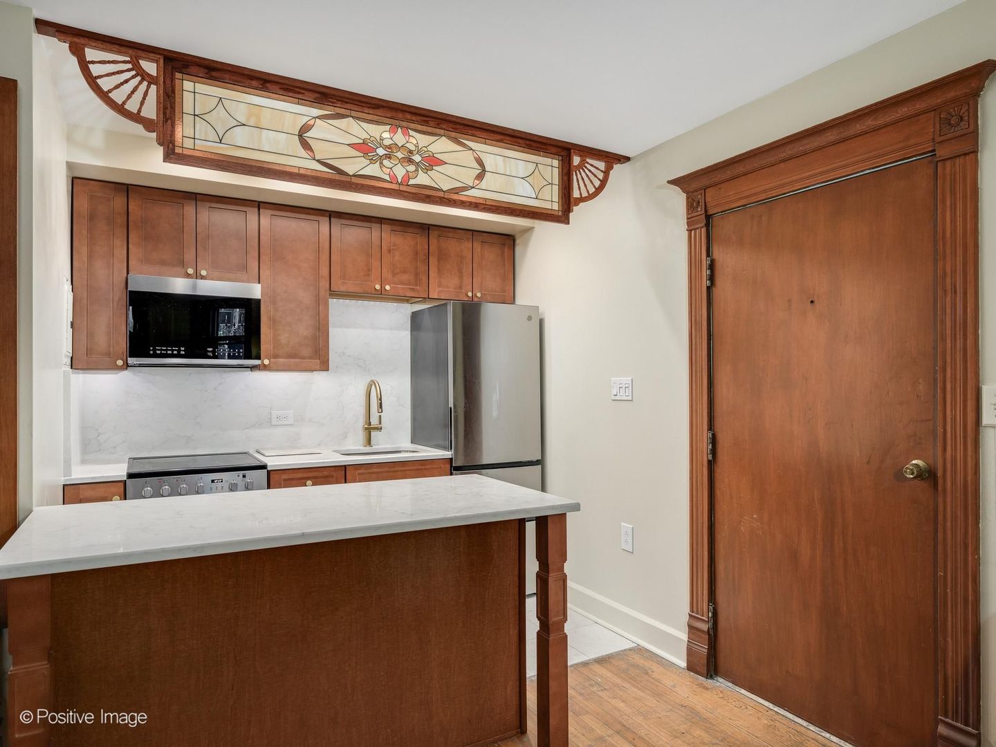 33 East Division Street Chicago, IL 60611 - Photo 33 of 34 a kitchen with stainless steel appliances a refrigerator and a microwave