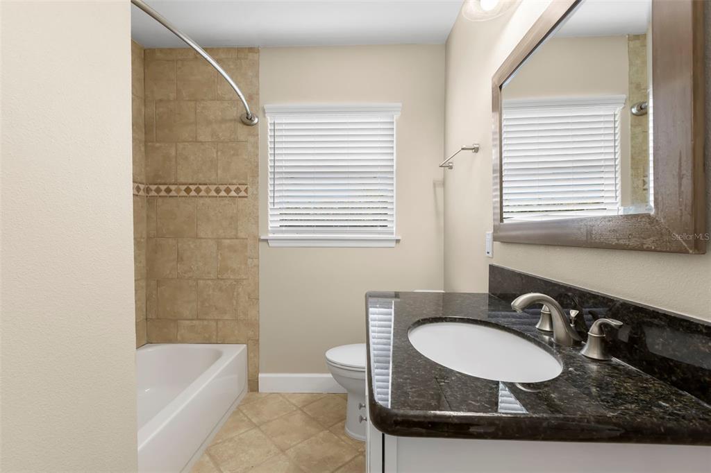 708 Sunset Cove Madeira Beach, FL 33708 - Photo 27 of 61 a bathroom with a sink and a bathtub