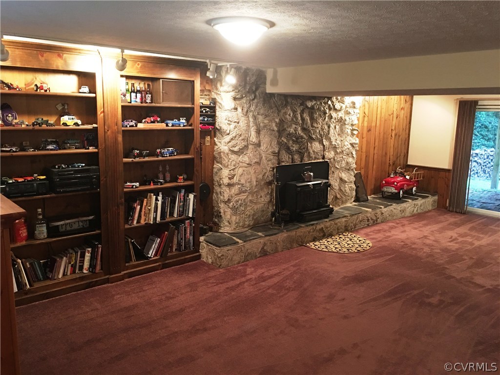 11420 Chalkley Road Chester, VA 23831 - Photo 11 of 43 a room with lots of books and a large window