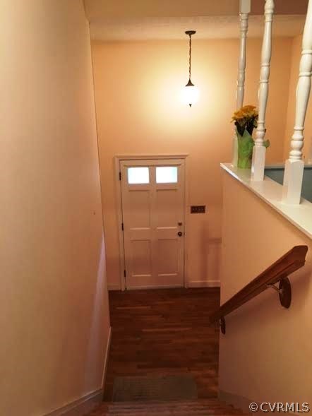 11420 Chalkley Road Chester, VA 23831 - Photo 13 of 43 a view of a hallway with wooden floor and staircase