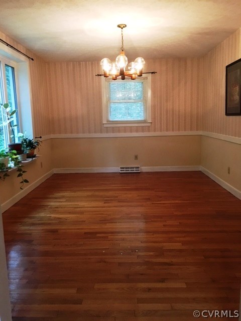 11420 Chalkley Road Chester, VA 23831 - Photo 16 of 43 an empty room with wooden floor and windows
