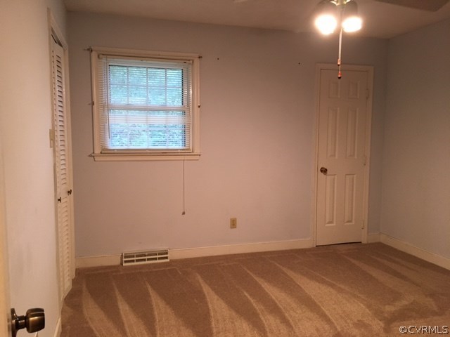 11420 Chalkley Road Chester, VA 23831 - Photo 18 of 43 a view of a livingroom with an empty space and a window