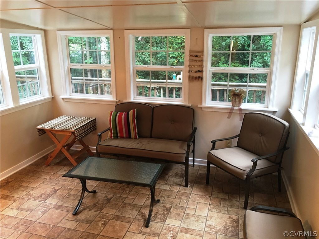 11420 Chalkley Road Chester, VA 23831 - Photo 23 of 43 a living room with furniture and a large window