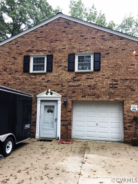 11420 Chalkley Road Chester, VA 23831 - Photo 36 of 43 a front view of a house with garage