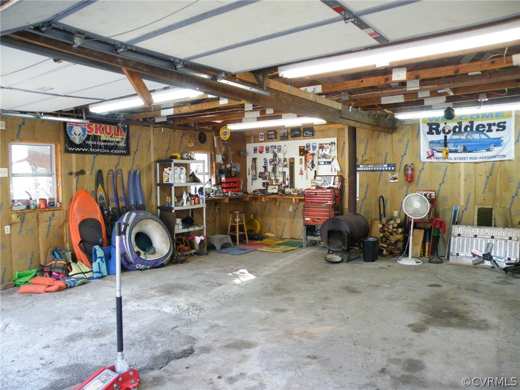 11420 Chalkley Road Chester, VA 23831 - Photo 40 of 43 a view of a garage with a bike and car