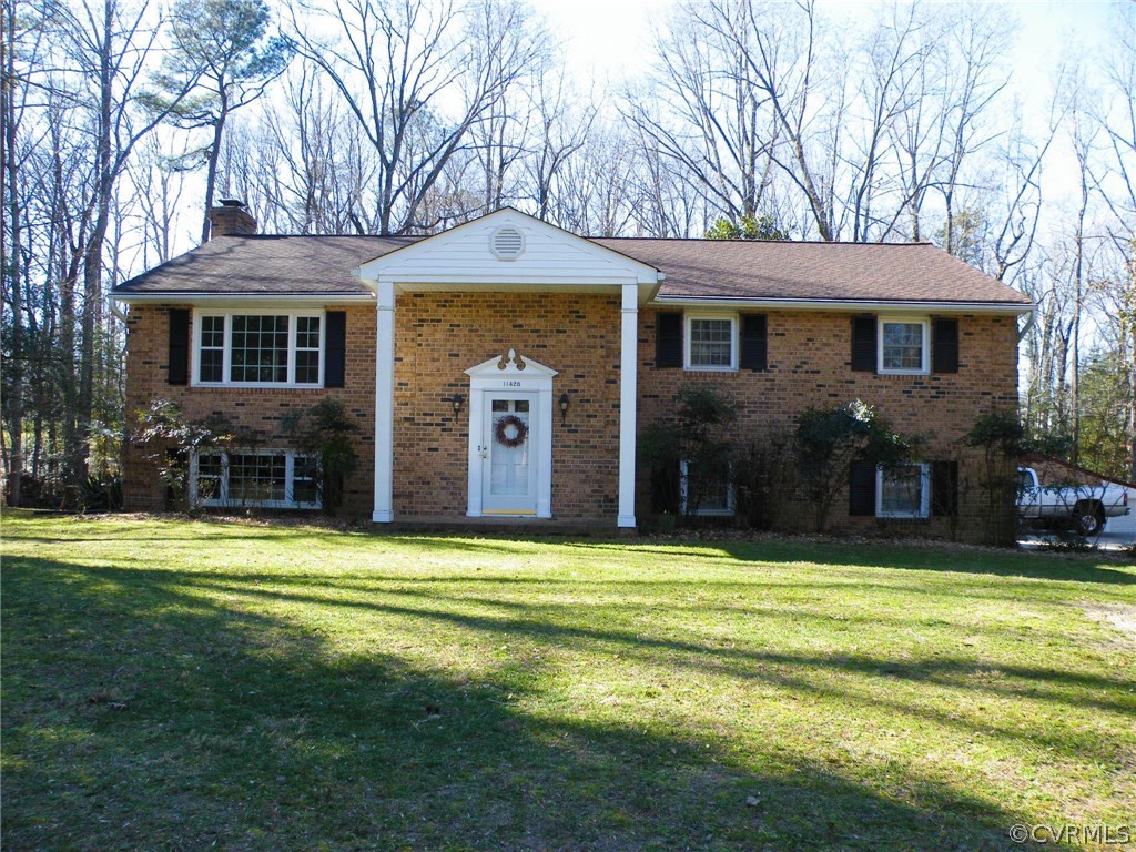 11420 Chalkley Road Chester, VA 23831 - Photo 43 of 43 a front view of a house with a garden