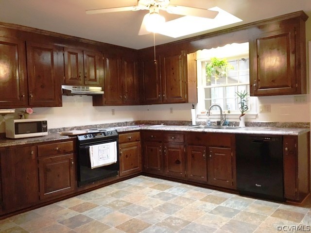 11420 Chalkley Road Chester, VA 23831 - Photo 5 of 43 a kitchen with stainless steel appliances granite countertop wooden cabinets a stove top oven a sink and dishwasher