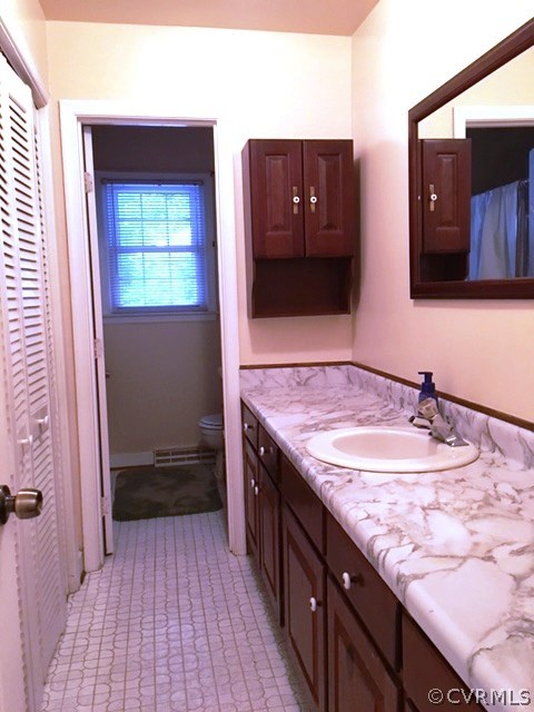 11420 Chalkley Road Chester, VA 23831 - Photo 8 of 43 a bathroom with a sink and a mirror